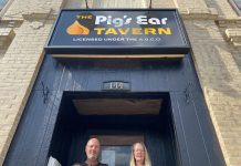 The Pig's Ear Tavern owners Steve Robertson and Ashley Holmes at the pub's entrance at 144 Brock Street in downtown Peterborough. The former Trent University students purchased the building in 2022 with help from two investors, and are hard at work to restore the beloved pub to its former glory and introduce some of the events that made it a unique destination for the community, with an expected opening in fall 2023. (Photo: Paul Rellinger / kawarthaNOW)