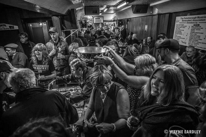 Prior to its closure in 2017, The Pig's Ear Tavern hosted the Peterborough Musicians Benevolent Association's monthly Deluxe Blues Jam. Photographer Wayne Eardley took this evocative shot of the crowd of live music fans at the final jam on April 15, 2017. (Photo: Wayne Eardley)