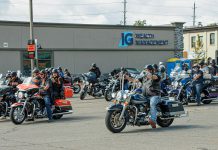 Motorcycle enthusiast Terry Guiel (closest to camera), executive director of the Peterborough Downtown Business Improvement Area (DBIA), leads participants in Peterborough's first-ever United on the Highway Poker Run on August 26, 2023, raising funds for United Way Peterborough & District. The event was organized by the DBIA in partnership with Cogeco and the United Way with prizes donated by sponsors including Lafarge, Euphoria Wellness Spa, Liftlock Cruises, Classy Chassis, Team VanRahan Century 21, Cogeco, Sink or Swim Tattoos, and Peterborough & the Kawarthas Tourism. (Photo courtesy of Peterborough DBIA)