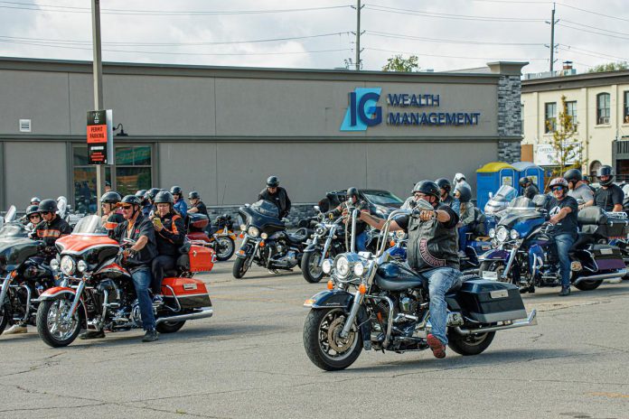 Motorcycle enthusiast Terry Guiel (closest to camera), executive director of the Peterborough Downtown Business Improvement Area (DBIA), leads participants in Peterborough's first-ever United on the Highway Poker Run on August 26, 2023, raising funds for United Way Peterborough & District. The event was organized by the DBIA in partnership with Cogeco and the United Way with prizes donated by sponsors including Lafarge, Euphoria Wellness Spa, Liftlock Cruises, Classy Chassis, Team VanRahan Century 21, Cogeco, Sink or Swim Tattoos, and Peterborough & the Kawarthas Tourism. (Photo courtesy of Peterborough DBIA)