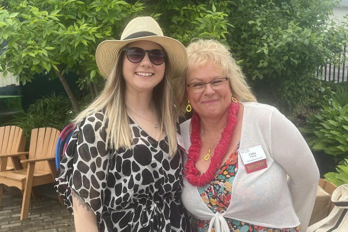 Katelyn Kemp, incoming president of the Women's Business Network of Peterborough (WBN), and past secretary Cathy Farley enjoying the sun at the 2022 June Beach Party Social. As the networking organization's new president, Kemp is getting "back to the basics" after a few years of pandemic adjustments made to the network's programming. This year's theme is "Empowered Women ... Empower Women." (Photo courtesy of WBN)