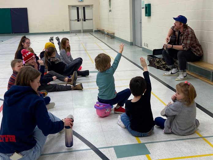 Warren Frank (top right), coordinator of music and digital arts at BGC Kawarthas, teaches song writing to children at an after-school program. Designed for youth 12 to 18 years old, the new "Story of Us" soundscape music creation program at BGC Kawarthas expands the organization's music programming offerings beyond song writing and production-based programming. (Photo courtesy of BGC Kawarthas)