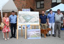 At its 70th anniversary barbeque on August 26, 2023, Campbellford Memorial Hospital unveiled the first rendering of its proposed "Campus of Care" to be located on County Road 30 just west of Campbellford. Pictured from left to right are Campbellford Memorial Hospital board chair Carrie Hayward, Trent Hills deputy major Michael Metcalf, Northumberland-Peterborough South MPP David Piccini, Campbellford Memorial Hospital CEO Jeff Hohenkerk, and Jim Curle, who donated the land for the Campus of Care site. (Photo courtesy of Campbellford Memorial Hospital)