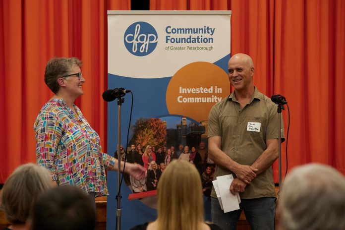 Community Foundation of Greater Peterborough executive director Jennifer DeBues (left) with Jacob Rodenburg, executive director of outdoor and environmental organization Camp Kawartha, during the Foundation's June 2023 community celebration of local non-profit organizations, agency fund holders and designated fund holders, donors, supporters, and Foundation board members past and present. For the past 10 years, DeBues has worked to help the Foundation fulfill its purpose of inspiring giving to build a vital community for everyone. (Photo: Wayne Eardley courtesy of the Community Foundation of Greater Peterborough)