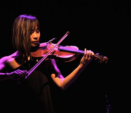 Peterborough electric violinist Victoria Yeh is one of 24 local artists who have been awarded a collective total of $57,425 through the grants for individual artists program, jointly funded by the Electric City Culture Council and the City of Peterborough. Yeh's grant will support her "Timeless" concert at the Market Hall in Peterborough on December 21, 2023, which includes the world premiere of Yeh's "Winter in Canada," new music from Yeh and Peterborough guitarist Mike Graham, and more. (Photo: Trevor Hesselink / Groundswell Photography)