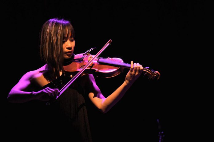 Peterborough electric violinist Victoria Yeh is one of 24 local artists who have been awarded a collective total of $57,425 through the grants for individual artists program, jointly funded by the Electric City Culture Council and the City of Peterborough. Yeh's grant will support her "Timeless" concert at the Market Hall in Peterborough on December 21, 2023, which includes the world premiere of Yeh's "Winter in Canada," new music from Yeh and Peterborough guitarist Mike Graham, and more. (Photo: Trevor Hesselink / Groundswell Photography)