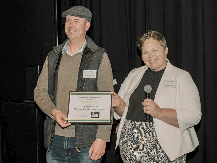 Norm Lamothe of Woodleigh Farms in Cavan received the "Leadership in Climate Resilient Agriculture" award from Farms at Work executive director Heather Ray at Peterborough GreenUP's second annual Leadership in Sustainability Awards event on May 4, 2023. Lamothe's farm received the award for their commitment to reducing their environmental impact, educating others, and demonstrating that eco-friendly agricultural practices can provide an economic advantage. (Photo: Heather Doughty Photography)