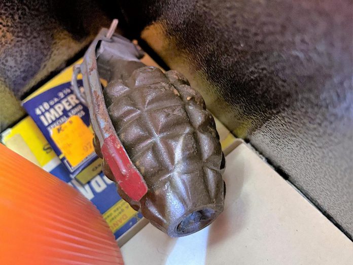 A person found this grenade in a firearms safe in their deceased father's Selwyn Township home on August 31, 2023. The person contacted Peterborough County OPP who subsequently consulted with the Department of National Defence, with a military bomb technician ultimately disposing of the grenade. (Police-supplied photo)