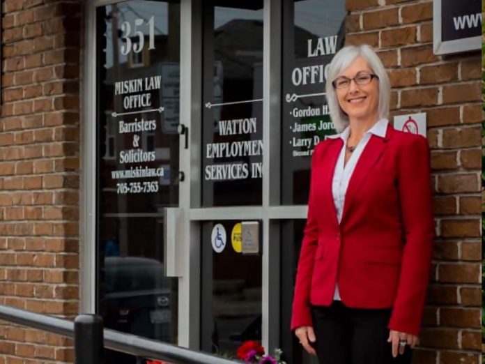 Certified hypnotist Rebecca O'Rourke in front of the entrance to 351 Charlotte Street in downtown Peterborough where her Kawartha Hypnosis clinic is located. She is hosting a free five-year anniversary and grand re-opening event on September 14, 2023. The afternoon event will include a free BBQ lunch, a tour of the renovated clinic, and an educational talk on using hypnosis for healing. (Photo courtesy of Rebecca O'Rourke)