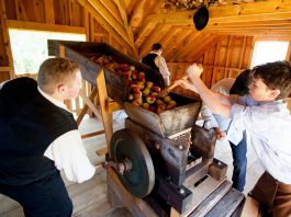 Learn how 19th-century settlers preserved the fall harvest and prepared for the winter during Applefest at Lang Pioneer Village Museum in Keene on October 1, 2023. There will be many historic demonstrations including cider pressing at the Cider Mill, as well as live entertainment, games and crafts, apples and apple products to purchase, and more. (Photo: Lang Pioneer Village Museum)