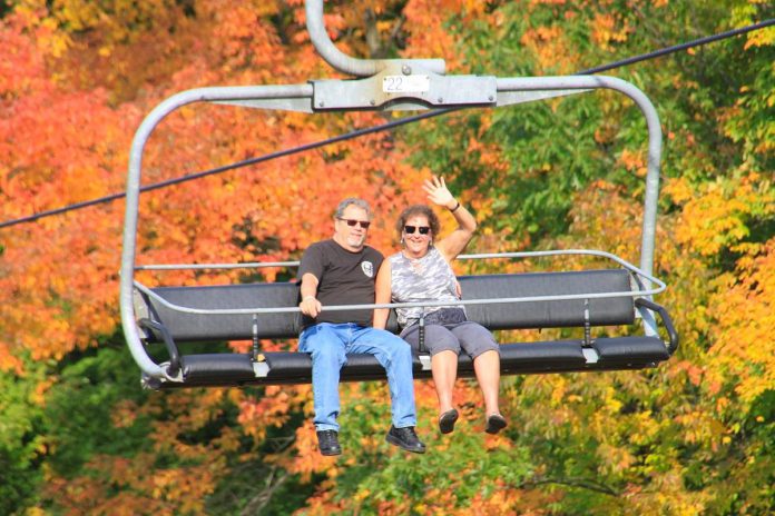 From celebrating the fall harvest to riding the midway at a fall fair to watching a spooky play, there are plenty of family activities to enjoy across the Kawarthas region during October, including soaking in the fall colours with a scenic chairlift ride at Sir Sam's Ski / Ride on Eagle Lake near Haliburton during the resort's annual fall colour festival. (Photo: Sir Sam's)
