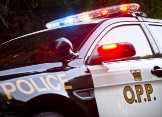 An Ontario Provincial Police (OPP) police car with lights flashing. (Photo: OPP)