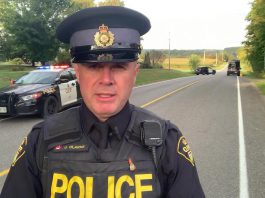 Constable James Clarke of the Northumberland OPP near the scene of a fatal single-vehicle collision on the afternoon of September 28, 2023. (kawarthaNOW screenshot of OPP video)