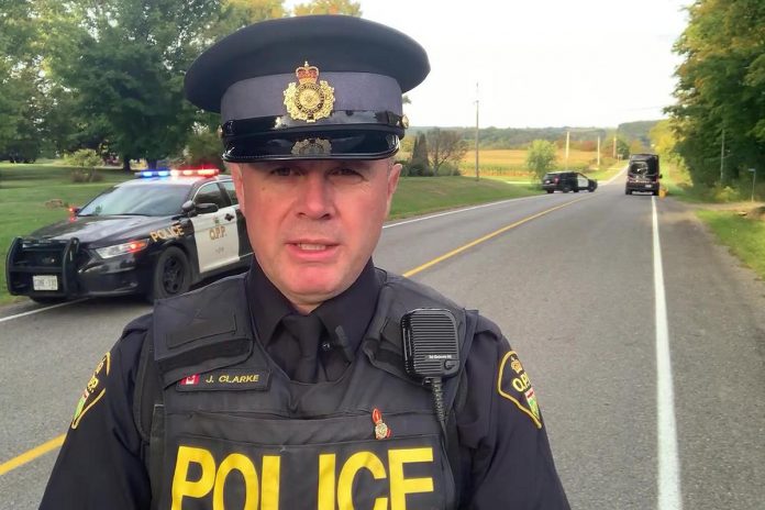 Constable James Clarke of the Northumberland OPP near the scene of a fatal single-vehicle collision on the afternoon of September 28, 2023. (kawarthaNOW screenshot of OPP video)