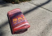 The final print edition of Peterborough This Week lies on a Peterborough sidewalk on September 15, 2023. Metroland Media Group has announced it is ending the print editions of its 70 community newspapers as it seeks protection under the Bankruptcy and Insolvency Act as part of a restructuring plan. (Photo: Bruce Head / kawarthaNOW)