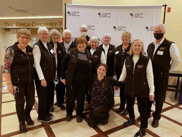 ReFrame Film Festival's festival director Kait Dueck (kneeling) with Showplace Performance Centre volunteers at the 2023 ReFrame Film Festival. Preparations are underway for the 20th anniversary festival in 2024, which will continue the online screenings that began during the pandemic but will reintroduce a series of in-person events. (Photo: Amelia Foley)