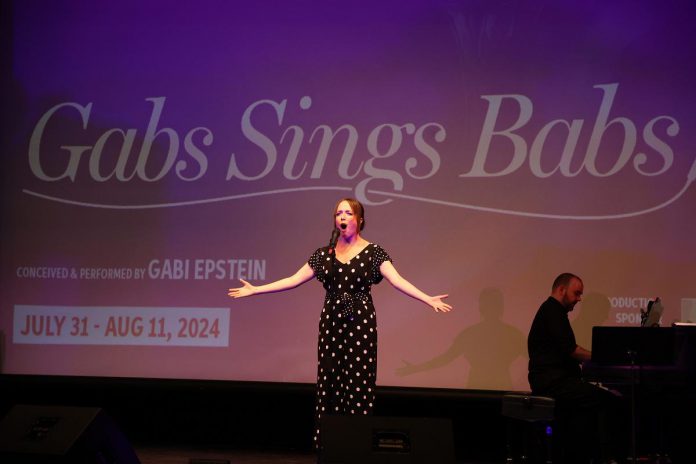 Dora award-winning singer and cabaret performer Gabi Epstein gave the audience a taste of her show "Gabs Sings Babs" during the Capitol Theatre's 2024 season launch event in Port Hope on October 5, 2023. Presented at the Capitol next summer, the show tells the story of Epstein’s own artistic journey through Barbra Streisand's iconic music in original arrangements.  (Photo: Heather Doughty / kawarthaNOW)