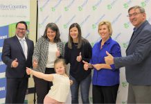 Seven-year-old Alexa and her mom Ashley Kulla (third from left) joined Five Counties CEO Scott Pepin and board of directors chair Julie Davis (left and second from left) and Haliburton-Kawartha Lakes-Brock MPP Laurie Scott and Peterborough-Kawartha MPP Dave Smith for a thumbs-up after the Ontario government announced an increase of $2 million in funding for the charitable organization on October 12, 2023. (Photo courtesy of Five Counties Children Centre).