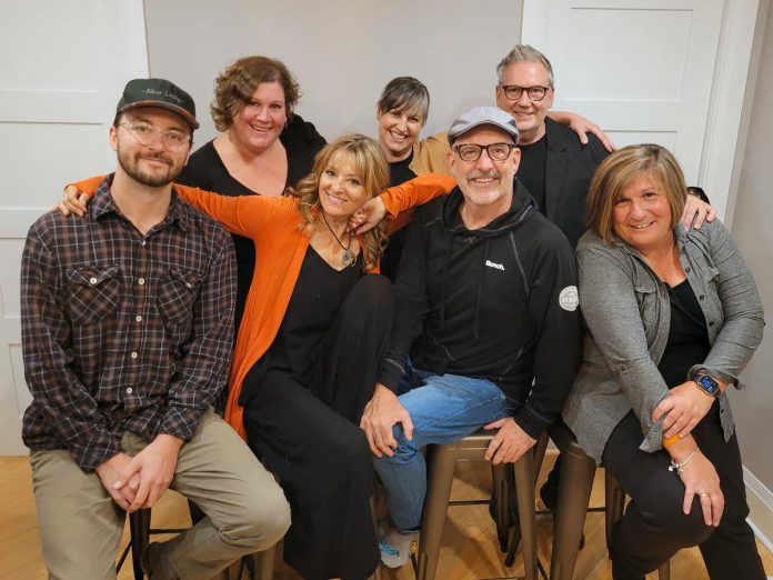 A variety show fundraiser for Camp Kerry Ontario, Keep'n It Campy on November 11, 2023 at Market Hall in downtown Peterborough centres around the theme of camping, with comedic skits, improv, live music, and audience interaction. Organizing committee members and performers include (left to right, front and back row) Stephen Cullen, Lisa Devan, Paul Crough, Angela Gaskell, Kate Brioux, Bridget Foley, and host Andrew Finlan. Streaming tickets are still available for the sold-out show and organizers are accepting donations for the gift baskets that will be given away at the show. (Photo courtesy of Keep'n It Campy)