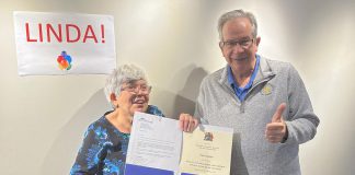 Peterborough Mayor Jeff Leal presented longtime volunteer Linda Shisko with a letter and certificate from the City of Peterborough recognizing her 30 years of volunteer service to the community at the Market Hall in Peterborough on October 20, 2023. Linda, who has provided weekly cleaning services for at least a dozen non-profit agencies since 1996, is retiring in advance of her 73rd birthday. (Photo: Eva Fisher / Public Energy Performing Arts)