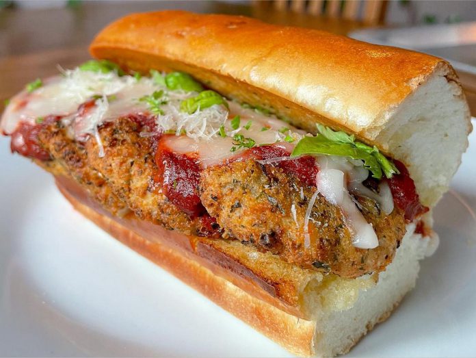 Nateure's Plate chef Nathan White specializes in plant-based meat and cheese alternatives, like this chicken parmesan sandwich on house-made bread. After the eatery closes, Nathan will be supplying a plant-based product line to grocery stores through Nateure's Plant Based Food Co. (Photo courtesy of Nateure's Plate)