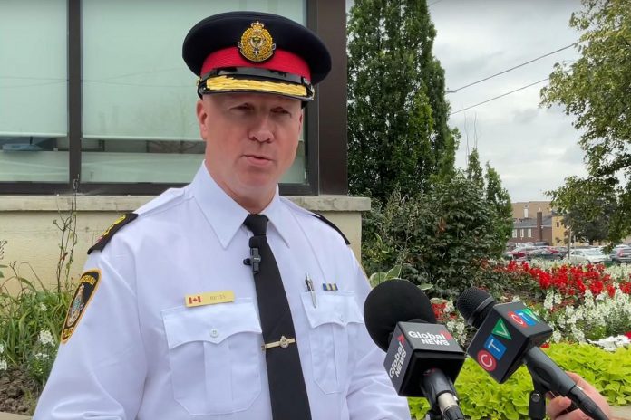 Peterborough police chief Stuart Betts speaking to the media outside the Peterborough police station at Water and McDonnel streets in downtown Peterborough on July 2, 2022. (kawarthaNOW screenshot of police video)