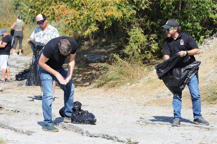 A record-breaking 70 volunteers participated in the October 1st Gananaska River clean-up led by Port Hope councillor and Queenies Bake Shop owner Adam Pearson. Each year, the clean-up takes place at the end of salmon and trout fishing season. In the past few years, many residents have noticed an increased amount of waste, discarded fish, and fish hooks found around the river following the salmon run. (Photo: Adam Pearson)