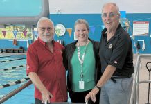 Rotary Club of Peterborough-Kawartha secretary Len Lifchus and community service projects chair Bill Gordanier (left and right) with YMCA Balsillie Family Branch general manager MaryAnne Wooldridge with the new aquatics wheelchair made possible by a Rotary donation. (Photo courtesy of YMCA of Central East Ontario)