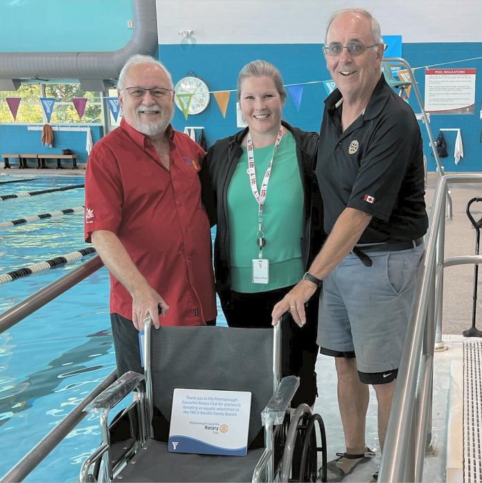 Rotary Club of Peterborough-Kawartha secretary Len Lifchus and community service projects chair Bill Gordanier (left and right) with YMCA Balsillie Family Branch general manager MaryAnne Wooldridge with the new aquatics wheelchair made possible by a Rotary donation. (Photo courtesy of YMCA of Central East Ontario)