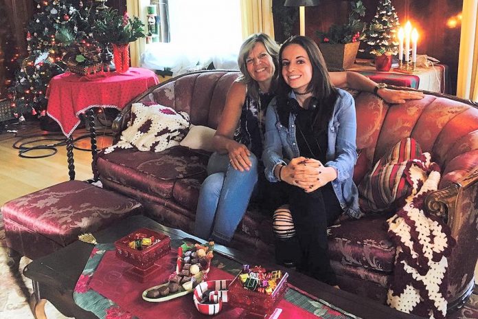 Wendy Smale with her daughter Carley on the set for the 2017 Lifetime holiday film "Snowed-Inn Christmas," for which Carley wrote the screenplay. Throughout her years as an educator, Wendy amassed large collections of children's books, which inspired Carley's love of reading and writing, and has also helped Carley with the editing of her screenplays. Now the duo have written "Tiny Astronaut," their first children's book. (Photo courtesy of Wendy and Carley Smale)