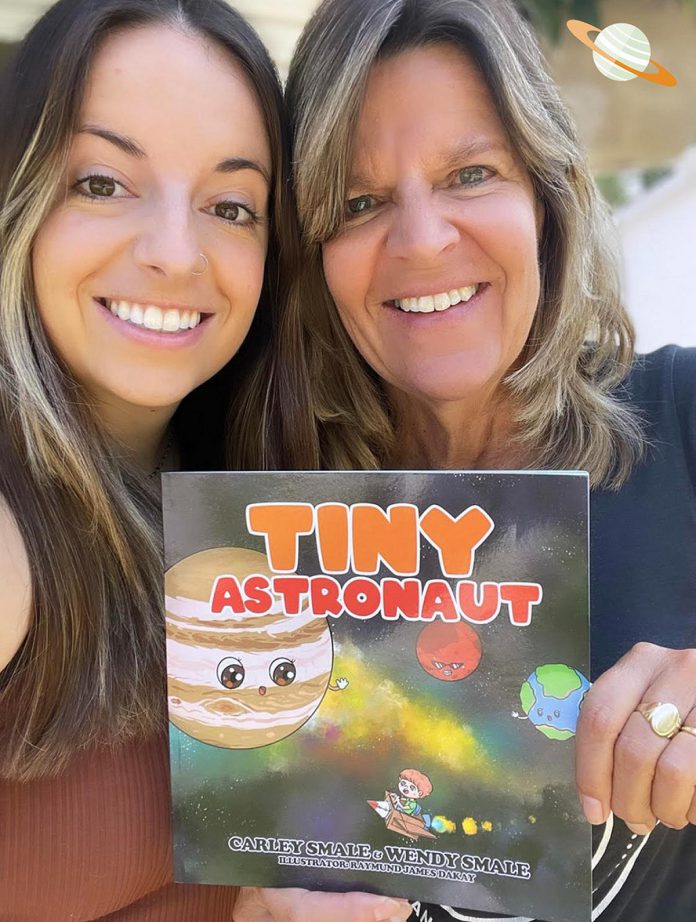 Daughter-mother writing duo Carley and Wendy Smale with their new children's book "Tiny Astronaut" featuring illustrations by Raymund James Dakay. The book tells the story of Oliver, a young boy who gets bullied for being smaller than his peers. When he tours outer space and meets the different planets, Oliver learns his own self-worth and discovers that being small doesn't mean he can't make a difference in the world.  (Photo courtesy of Wendy and Carley Smale)