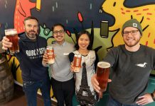 Reggie Maranda of Mcthirsty's Pint (left) and Garrett Bulmer of Bobcaygeon Brewing Company (right), pictured with Mauricio Interiano and Paris Nguyen of the New Canadians Centre, raise a pint of West Coast Pale Ale, the third beer in the 'Community Brew' series, with a portion of sales to be donated to New Canadians Centre. (Photo: Luke Best / Bobcaygeon Brewing Company)