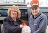 Lions Theresa Hewitt and Lucas with a donated turkey during the Great Turkey Exchange in 2022, when the East Peterborough Lions Club took over the long-running program. As well as delivering turkeys and hams to individuals and families in need, the Lions distributed them to organizations including One Roof, YES Shelter for Youth and Families, the Brock Mission, and the YWCA Crossroads Shelter. (Photo: East Peterborough Lions Club / Facebook)