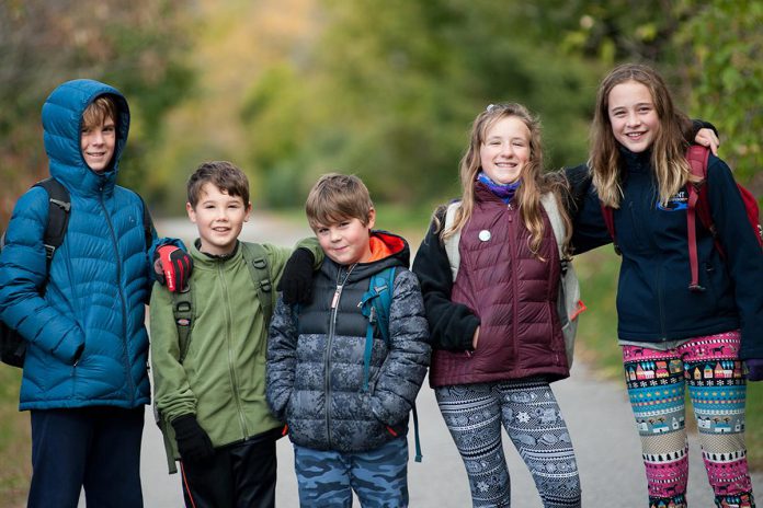 Five children on their way to school in Peterborough. Over the past few decades, the proportion of children who walk to school has decreased dramatically. (Photo: Active School Travel Peterborough)