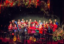 In From The Cold co-founder Susan Newman leading the Convivio Chorus during the benefit concert for Peterborough's YES Shelter for Youth and Families in 2015, including co-founders Rob Fortin (second row, far left), Curtis Driedger (back, far right), and John Hoffman (third row, second from right). In From The Cold returns for its 24th year on December 3 and 9, 2023 at Market Hall Performing Arts Centre. (Photo: Linda McIlwain / kawarthaNOW)