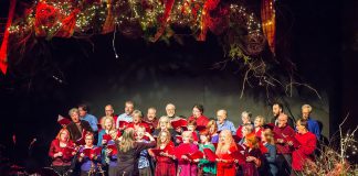 In From The Cold co-founder Susan Newman leading the Convivio Chorus during the benefit concert for Peterborough's YES Shelter for Youth and Families in 2015, including co-founders Rob Fortin (second row, far left), Curtis Driedger (back, far right), and John Hoffman (third row, second from right). In From The Cold returns for its 24th year on December 3 and 9, 2023 at Market Hall Performing Arts Centre. (Photo: Linda McIlwain / kawarthaNOW)
