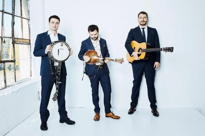 Juno-nominated and Canadian Folk Music Award winning Toronto-based bluegrass band The Slocan Ramblers (Frank Evans, Adrian Gross, and Darryl Poulsen with Charles James) are performing on Wednesday, December 6 at the Gordon Best Theatre in downtown Peterborough. (Photo via slocanramblers.com)