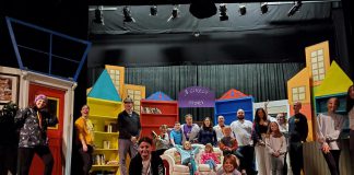 Cast and crew on the set for the Peterborough Theatre Guild's production of "The Enchanted Bookshop" by Todd Wallinger, which runs for eight performances from December 1 to 10, 2023. The family-friendly comic fantasy takes place in a used bookstore where literary characters come to life at night. (Photo courtesy of Peterborough Theatre Guild)