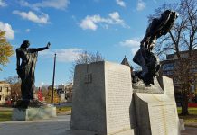Sculptor Walter Allward's war memorial in Peterborough features two allegorical figures in bronze, with the figure representing civilization standing in a commanding position with a sword in one hand and the other hand outstretched toward the figure representing strife, who is retreating with one arm covering his face in despair and the other carrying an extinguished torch. Dedicated to the 717 local men and women killed overseas, the memorial was unveiled on June 30, 1929 and was modified in 1978 to add bronze plaques with the names of the dead from the Second World War and the Korean War. (Photo: Great War 100 Reads website)
