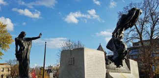 Sculptor Walter Allward's war memorial in Peterborough features two allegorical figures in bronze, with the figure representing civilization standing in a commanding position with a sword in one hand and the other hand outstretched toward the figure representing strife, who is retreating with one arm covering his face in despair and the other carrying an extinguished torch. Dedicated to the 717 local men and women killed overseas, the memorial was unveiled on June 30, 1929 and was modified in 1978 to add bronze plaques with the names of the dead from the Second World War and the Korean War. (Photo: Great War 100 Reads website)
