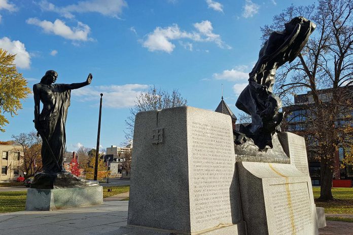 Sculptor Walter Allward's war memorial in Peterborough features two allegorical figures in bronze, with the figure representing civilization standing in a commanding position with a sword in one hand and the other hand outstretched toward the figure representing strife, who is retreating with one arm covering his face in despair and the other carrying an extinguished torch. Dedicated to the 717 local men and women killed overseas, the memorial was unveiled on June 30, 1929 and was modified in 1978 to add bronze plaques with the names of the dead from the Second World War and the Korean War. (Photo: Great War 100 Reads website)