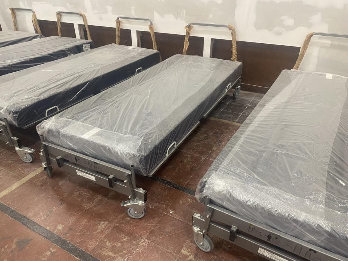 Some of the beds donated by Peterborough Regional Health Centre to One City Peterborough for the new Trinity Centre community hub for those experiencing homelessness at the former Trinity United Church on Reid Street in Peterborough. (Photo: Paul Rellinger / kawarthaNOW)