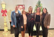 Four members of 100 Women Peterborough with Sue Armitage of Vinnies Peterborough (middle) on December 12, 2023 at The Venue in downtown Peterborough. The collective philanthropy group chose Vinnies to receive a donation of up to $10,000 from the group's membership. (Photo courtesy of 100 Women Peterborough)