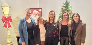 Four members of 100 Women Peterborough with Sue Armitage of Vinnies Peterborough (middle) on December 12, 2023 at The Venue in downtown Peterborough. The collective philanthropy group chose Vinnies to receive a donation of up to $10,000 from the group's membership. (Photo courtesy of 100 Women Peterborough)