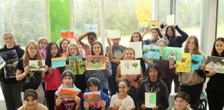 Grade 7 and 8 students from Kaawaatte East City Public School in Peterborough display the artworks they created this past fall during an outdoor art education experience at Ashburnham Memorial Park in fall 2023 led by volunteers with the Ashburnham Memorial Stewardship Group and local artist Laurel Paluck. The students' artworks are on display in the lower level of Peterborough Museum & Archives until December 30. (Photo courtesy of the Ashburnham Memorial Stewardship Group)