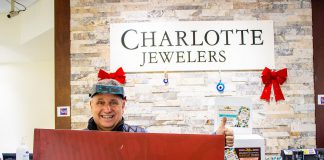 Charlotte Jewelers owner Levon Eginliyan gives the thumbs up after customer Margaret C. (not pictured) won a $500 Boro gift card after her Holiday Shopping Passport was drawn as the second early bird winner. (Photo courtesy of Peterborough DBIA)