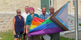 Kawartha Lakes Mayor Doug Elmslie (right) participating in the raising of the Pride flag at city hall in July 2023. The City of Kawarthas Lakes has joined the Coalition of Inclusive Municipalities, an initiative that fosters diversity, equality, and inclusivity across Canadian municipalities. (Photo: Kawartha Lakes Pride / Facebook)