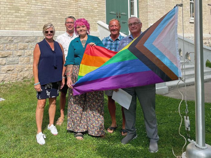 Kawartha Lakes Mayor Doug Elmslie (right) participating in the raising of the Pride flag at city hall in July 2023. The City of Kawarthas Lakes has joined the Coalition of Inclusive Municipalities, an initiative that fosters diversity, equality, and inclusivity across Canadian municipalities. (Photo: Kawartha Lakes Pride / Facebook)
