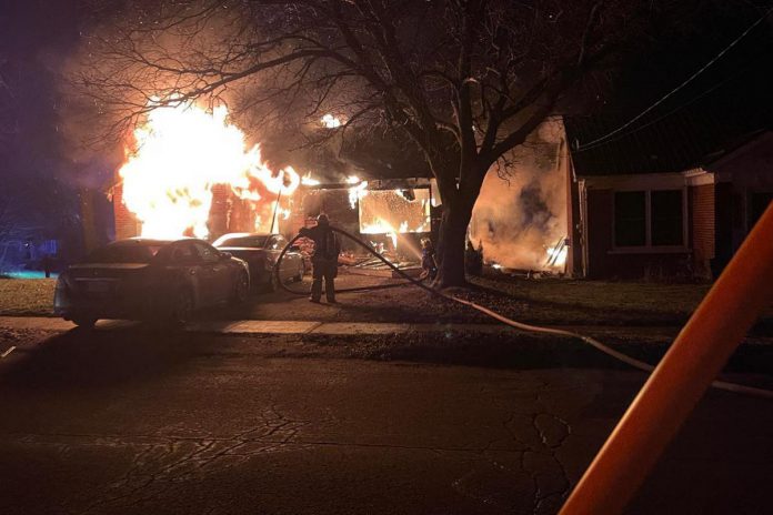 The fire that engulfed a home on Russell Street East in Lindsay on December 17, 2023 also damaged a neighbouring home, displacing a single mother and her son and their two pets. (Photo via GoFundMe)