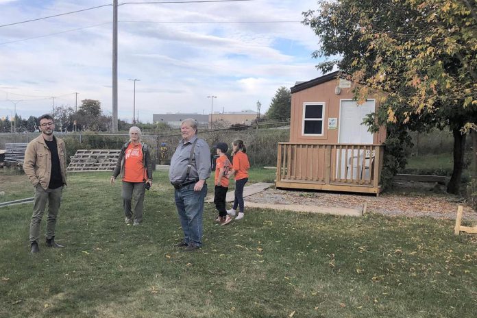 Tony D'Amato Stortz (left) of BetterStreet, a Toronto-based group that provides consulting services for organizations supporting people experiencing homelessness, helped guide Peterborough Action for Tiny Homes (PATH) towards using its current space at 385 Lansdowne Street in Peterborough to create the "Ready for Home" pilot program. Also pictured is a prototype sleeping cabin, one of 30 that will eventually be built at the location. (Photo courtesy of PATH)